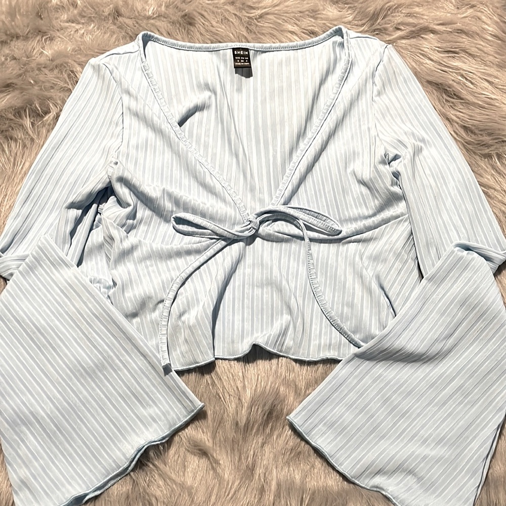 Cropped light blue blouse top.                                  Never worn.